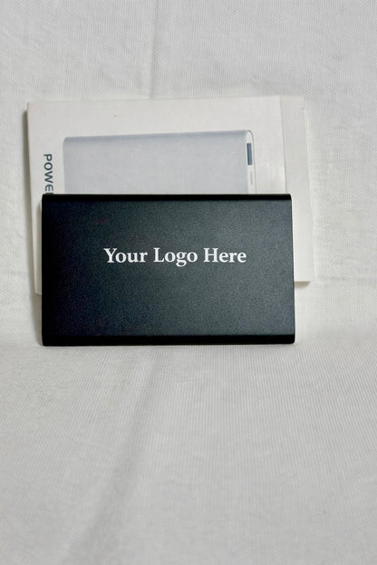 Black power bank to charge your phone. Custom engraving available.  