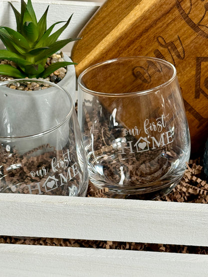 Two beautifully engraved wine cups, with a small plant.
