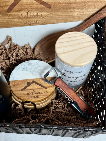 Decorative items including a wooden spoon, marble coaster set, candle, and bottle opener.